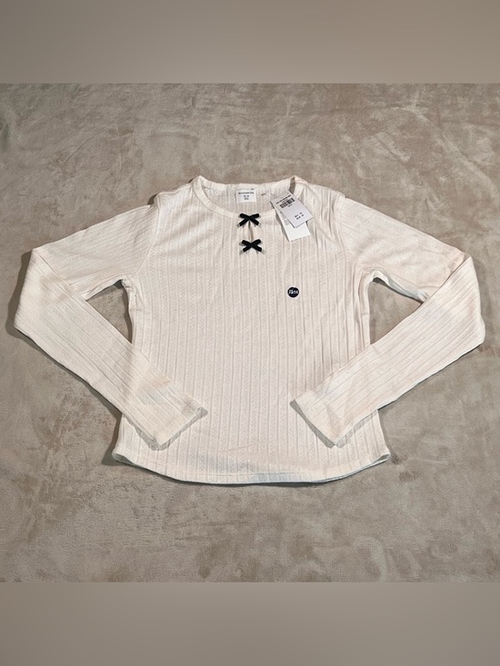 abercrombie kids Other - abercrombie kids Cream Ribbed Long-Sleeve Top with Black Bow Accents